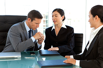 professionals around meeting table